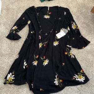 Free People dress or top. Black with floral design.